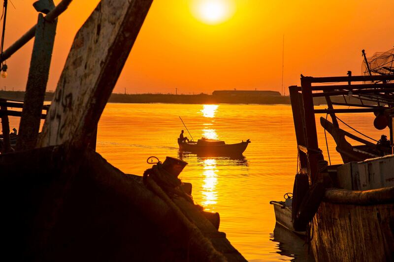 A man sits in fishing boat in the water of Shatt al-Arab in Iraq's southern port city of al-Faw, 90 kilometres south of Basra near the Gulf. AFP