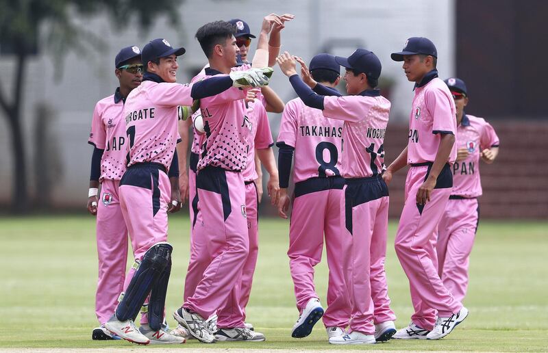 JOHANNESBURG, SOUTH AFRICA - JANUARY 13: Kento Ota of Japan is congratulated on bowling Angus Guy of Scotland  during the ICC U19 Cricket World Cup warm up match between Scotland and Japan at St John's College on January 13, 2020 in Johannesburg, South Africa. (Photo by Matthew Lewis-ICC/ICC via Getty Images)
