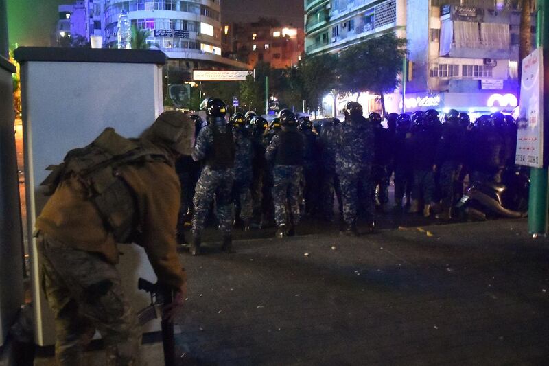 Lebanese soldiers and security clash with supporters of outgoing prime minister Saad Hariri during a protest in the Corniche al-Mazraa neighbourhood in the capital Beirut. AFP