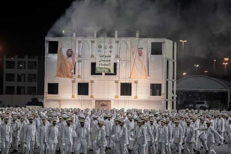 Banners showing Saudi King Salman and Crown Prince Mohammed bin Salman. AP
