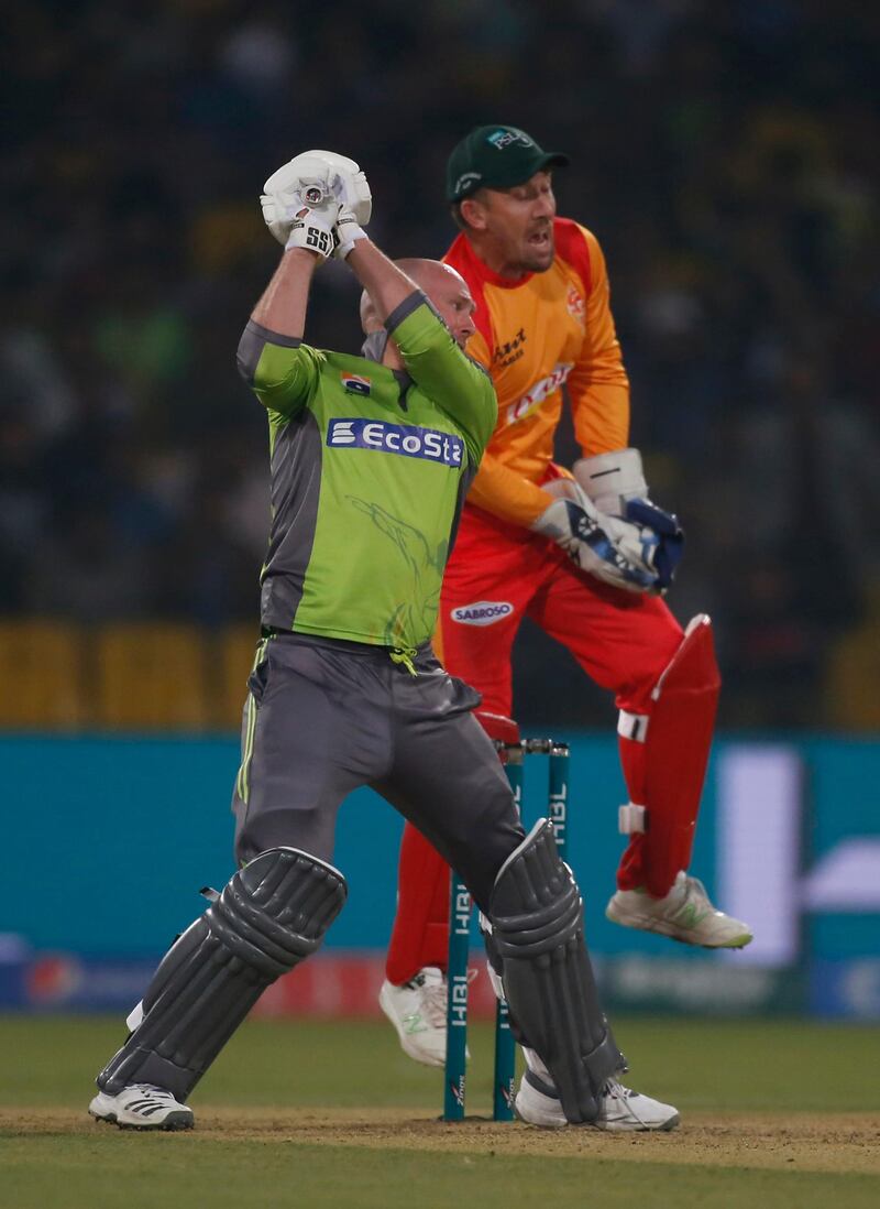 Ben Dunk is caught behind by Islamabad United wicketkeeper Luke Ronchi. AP Photo