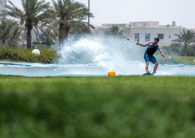 Abu Dhabi, United Arab Emirates, June 21, 2019.  Weather images.  Beating the heat at Al Forsan wakeboarding cable park. --  Rob Dam in action.
Victor Besa/The National
Section:  NA
Reporter: