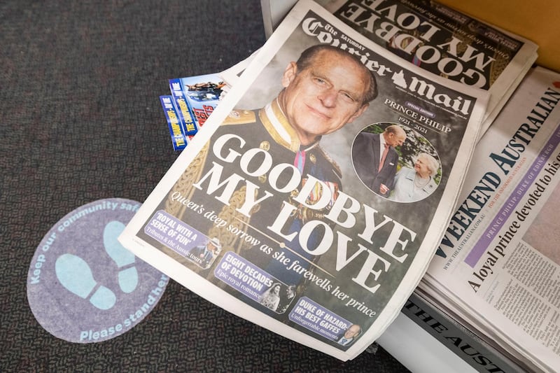 Copies of the 'Courier Mail' at a news stand in Brisbane, Australia, with news of Prince Philip's death. Getty Images