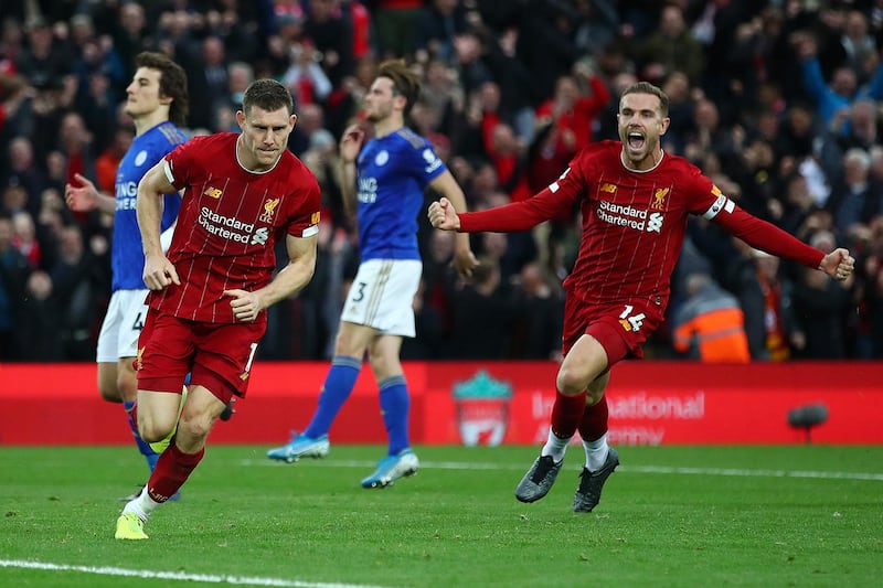 LIVERPOOL, ENGLAND - OCTOBER 05: James Milner of Liverpool celebrates with Jordan Henderson of Liverpool after he scores his sides second goal from the penalty spot during the Premier League match between Liverpool FC and Leicester City at Anfield on October 05, 2019 in Liverpool, United Kingdom. (Photo by Clive Brunskill/Getty Images)