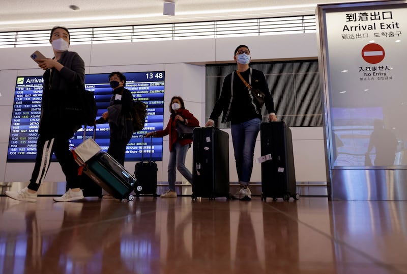 Passengers arrive at Haneda International Airport as Japan welcomes tourists again. Reuters