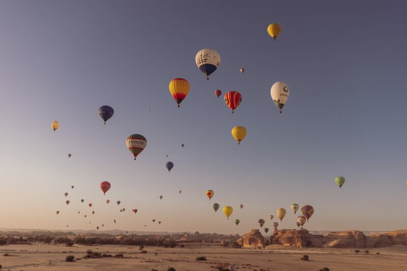 A colourful display of hot air balloons in AlUla.