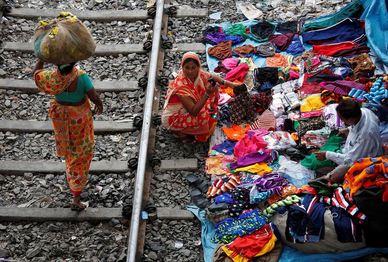 A woman shops beside a railway track in Kolkata. Rupak De Chowdhuri / Reuters