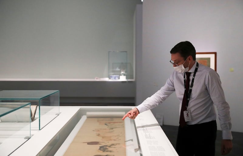 Guilhem Andre, chief curator at Louvre Abu Dhabi, explains the history behind the artefacts.  Khushnum Bhandari / The National