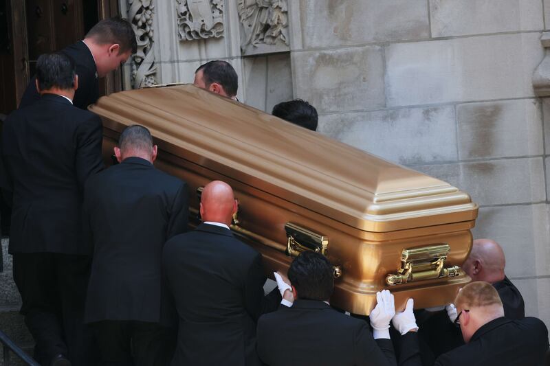 Pallbearers carry Ivana Trump's casket. AFP