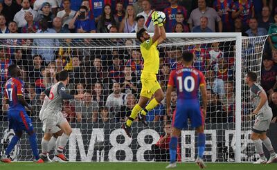 epaselect epa06960981 Liverpool's Alisson Becker (C) makes a save during the English Premier League soccer match between Crystal Palace and Selhurst Park in London, Britain, 20 August 2018.
 

EDITORIAL USE ONLY. No use with unauthorized audio, video, data, fixture lists, club/league logos or 'live' services. Online in-match use limited to 75 images, no video emulation. No use in betting, games or single club/league/player publications  EPA/NEIL HALL