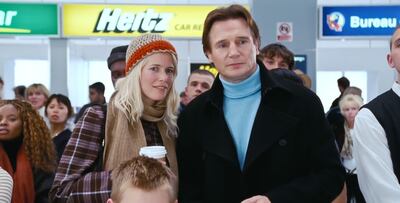 Liam Neeson and Claudia Schiffer during the airport scene in 'Love Actually'. Alamy
