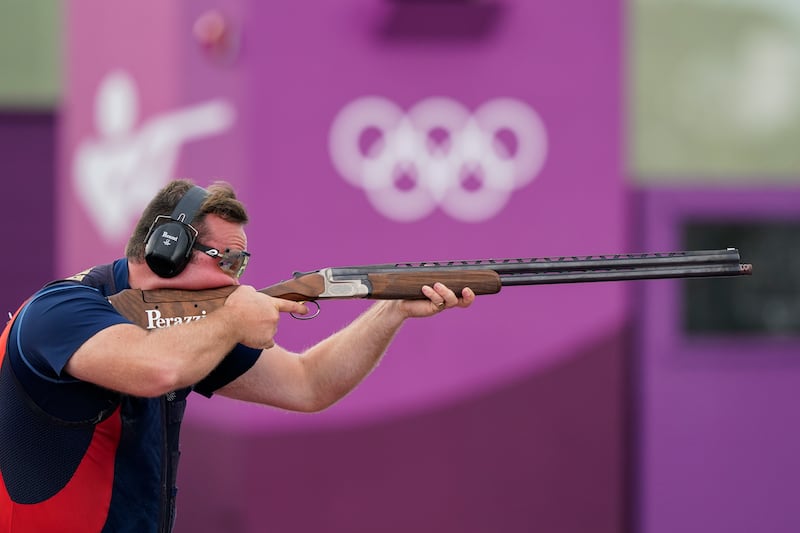 Matt Coward-Holley, of Britain, competes in the men's trap at the Asaka Shooting Range in the 2020 Summer Olympics.