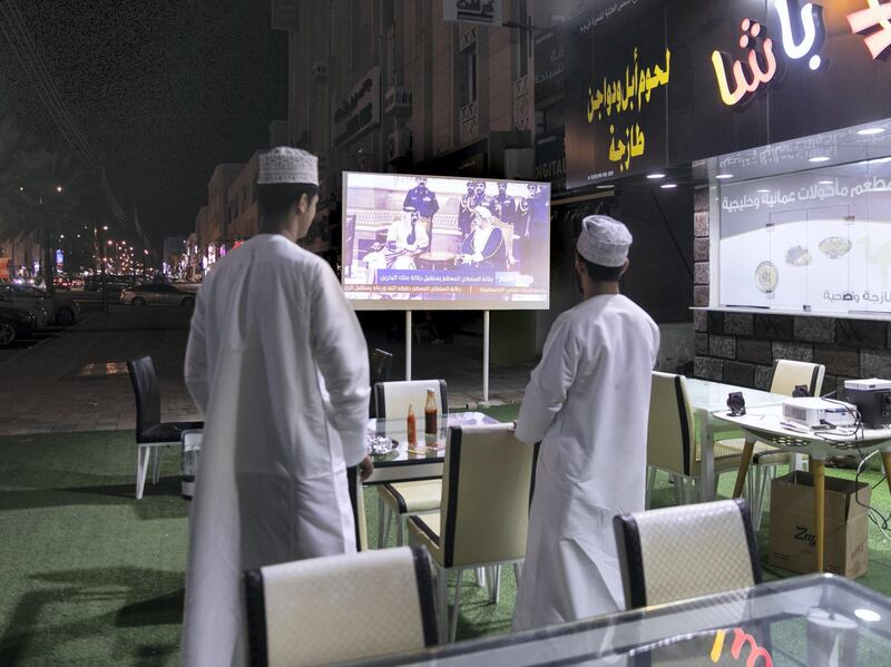 ABU DHABI, UNITED ARAB EMIRATES. 7 JANUARY 2020.
A group of men watch the news on a projector outside a restaurant in Al Khodh. 

Muscat on the first day of the passing of Sultan Qaboos bin Said, the Omani leader who ruled the country for nearly half a century, who has passed away at age 79.

(Photo: Reem Mohammed/The National)

Reporter:
Section: