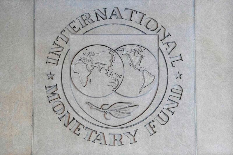 (FILES) In this file photo taken on September 4, 2018, the International Monetary Fund (IMF) seal is seen at its headquarters in Washington, DC.  While it is too soon to gauge the economic damage from the US government shutdown, the longer it continues the worse it will be, the International Monetary Fund warned on January 17, 2019. The shutdown that has left 800,000 federal workers nationwide without pay is the longest on record and now in its fourth week. / AFP / Jim WATSON
