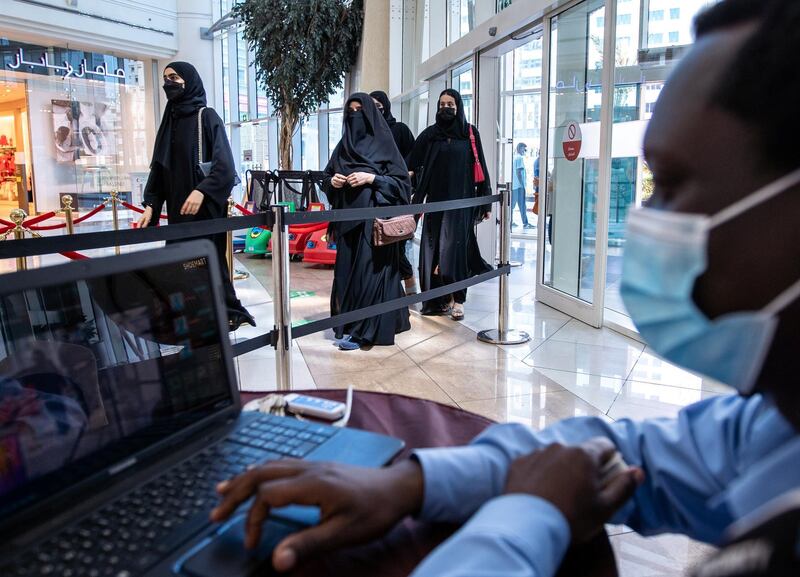 Al Hosn Green Pass awareness signages are put up at the Al Wahda Mall, Abu Dhabi on June 14th, 2021. The new Covid-19 restrictions start tomorrow. Victor Besa / The National.