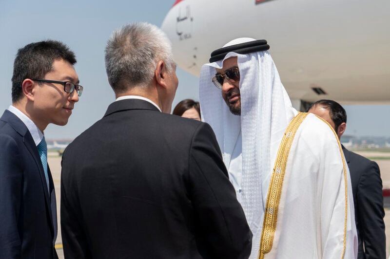 Sheikh Mohamed bin Zayed is greeted by Chinese officials upon his arrival to Beijing on Sunday. Rashed Al Mansoori / Ministry of Presidential Affairs