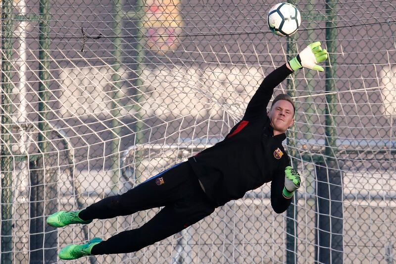 Barcelona goalkeeper Marc-Andre Ter Stegen makes a save during the training session. Pau Barrena / AFP