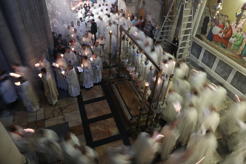 Latin clergymen in procession on Thursday during the Catholic Washing of the Feet ceremony in Easter holy week, next to the tomb of Jesus at the Church of the Holy Sepulchre in the Old City of Jerusalem. EPA