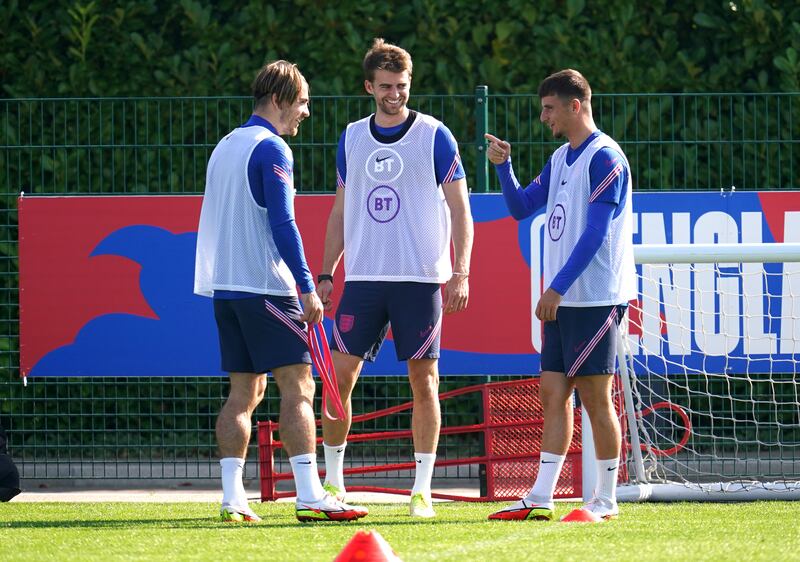 England's Jack Grealish, Patrick Bamford and Mason Mount during a training session at Hotspur Way. PA