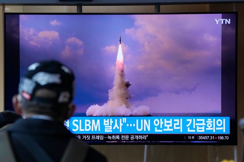 A man watches a TV screen showing an image of North Korea's ballistic missile launch from a submarine at Seoul Railway Station in Seoul, South Korea. AP
