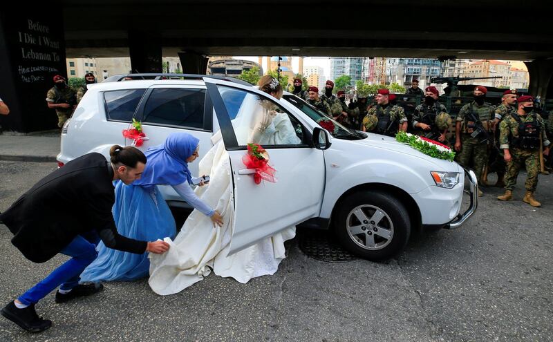 A bride gets into a car during a protest against the government performance and worsening economic conditions, in Beirut, Lebanon.  EPA