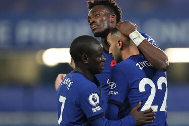 Chelsea's Tammy Abraham celebrates scoring their first goal with N'Golo Kante and Hakim Ziyech. Reuters
