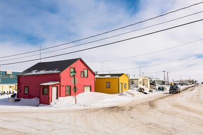 A street lined with pink and yellow houses in Barrow (Utqiagvik), Arctic Alaska, USA. Getty Images