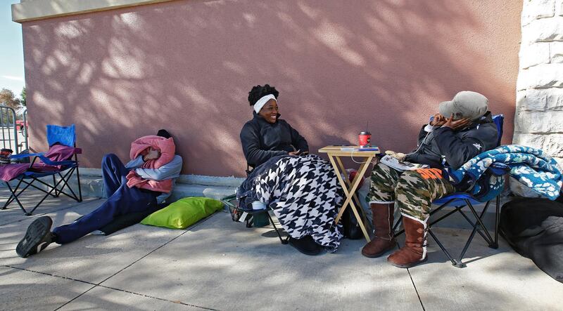 People camping outside the Best Buy store in hopes of being some of the first inside in Mesquite, Texas.  Larry W Smith / EPA