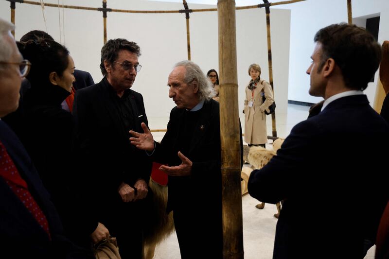 From left, actress Gong Li, musician Jean Michel Jarre, French history expert Patrice Fava and the French President during their visit to the Red Brick Museum in Beijing. AFP