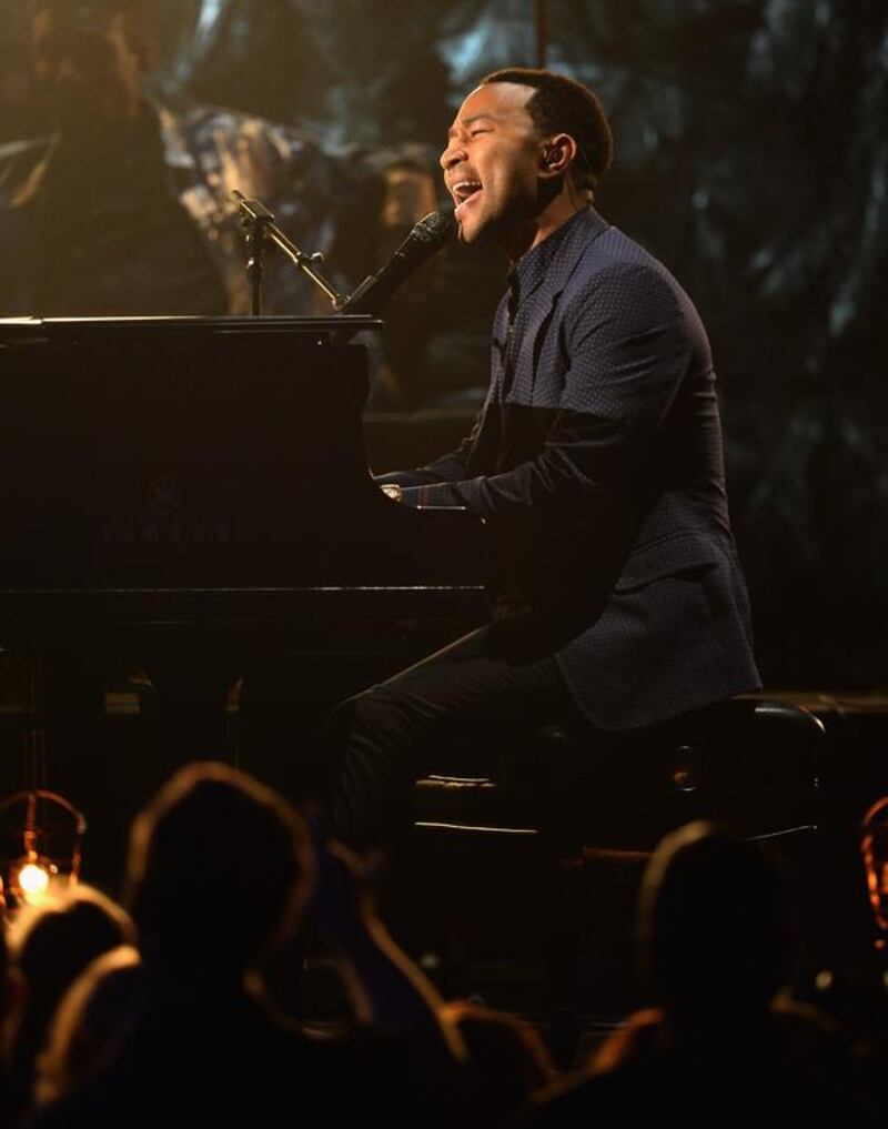Recording artist John Legend performs onstage. Ethan Miller / Getty Images / AFP