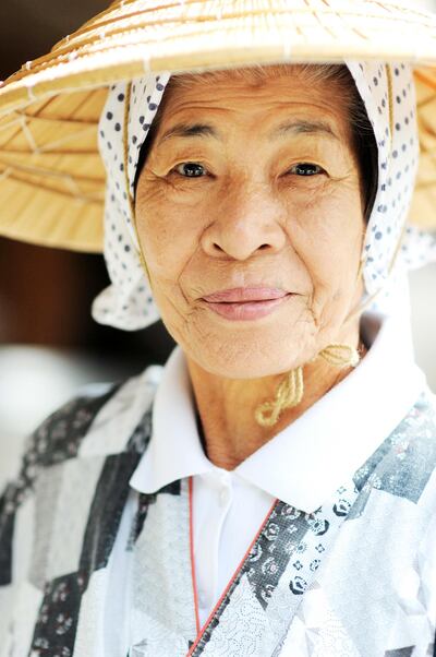 An Okinawan lady in traditional clothing. Getty Images