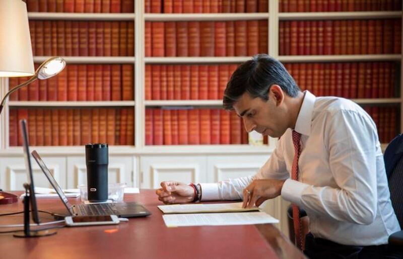 UK Chancellor Rishi Sunak working on a post-coronavirus budget with a smart mug in the background. Source HM Treasury