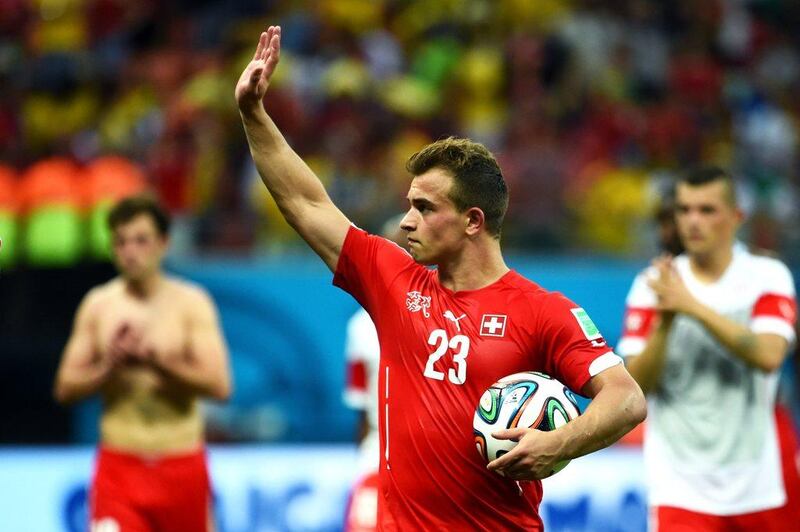 Xherdan Shaqiri acknowledges the crowd after Switzerland's 3-0 victory over Honduras on Wednesday at the 2014 World Cup in Manaus, Brazil. Stu Forster / Getty Images