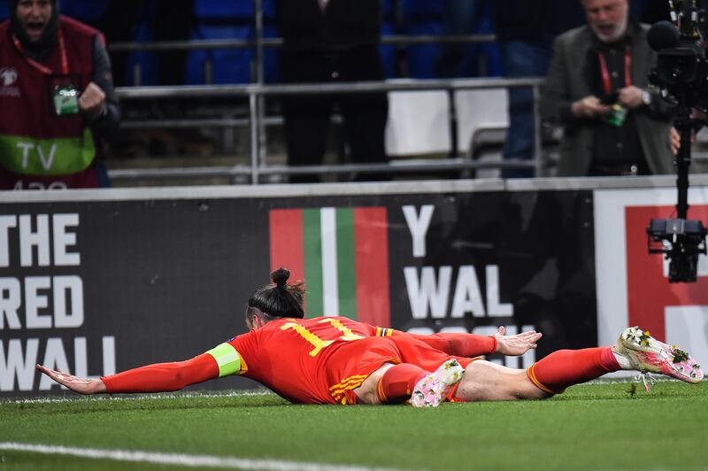 Gareth Bale celebrates after scoring for Wales against Austria during the  World Cup 2022 qualification playoff  in Cardiff, on March 24. EPA