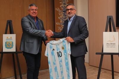 Argentina Football Association president Claudio Tapia, left, presents the national team shirt to Aref Al Awani. Photo: ADSC