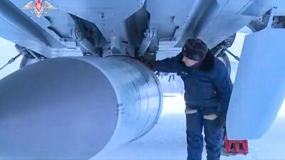A Kinzhal hypersonic missile is inspected before an MiG-31K fighter jet takes off. EPA