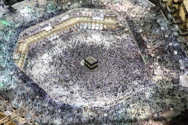 TOPSHOT - An aerial view shows Muslim pilgrims circumambulating the Kaaba, Islam's holiest shrine, at the Grand Mosque in Saudi Arabia's holy city of Mecca on September 3, 2017, during the annual Hajj pilgrimage. / AFP PHOTO / BANDAR ALDANDANI