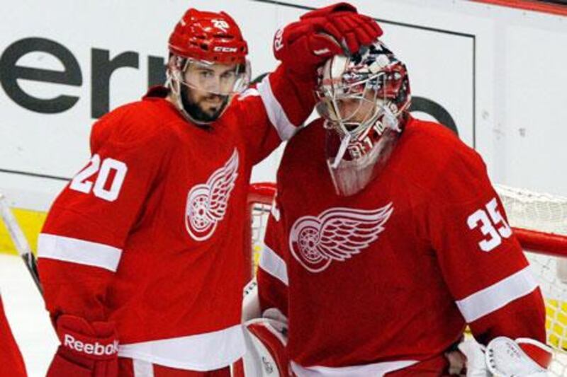 Jimmy Howard, No 35, made 15 of his 39 saves in the first period for the Detroit Red Wings. Rebecca Cook / Reuters