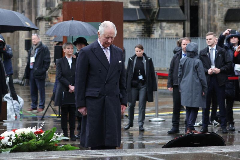 King Charles paid his respects during a wreath-laying ceremony during a visit to the St Nikolai Memorial Church. AFP