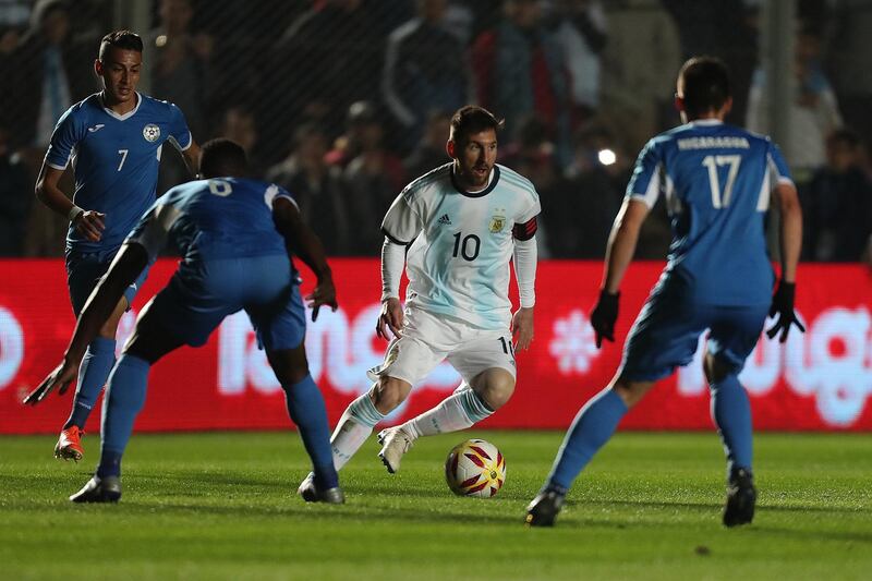 Argentina's Lionel Messi, left, in action against Nicaragua in San Juan, Argentina, on Friday. Marcelo Ruiz / EPA