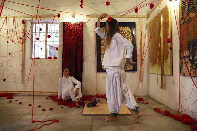 DUBAI , UNITED ARAB EMIRATES , March 17 – 2019 :- ‘The Weave of Life’ ,Installation & Loom-ing performance by Mioara Corozel Cherki ( left sitting ) & Fleur Antoine- Hindermeyer (right) at the SIKKA ART FAIR held at Al Fahidi Historical Neighbourhood in Dubai. ( Pawan Singh / The National ) For ARTS AND LIFESTYLE. Story by RUPERT HAWKSLEY