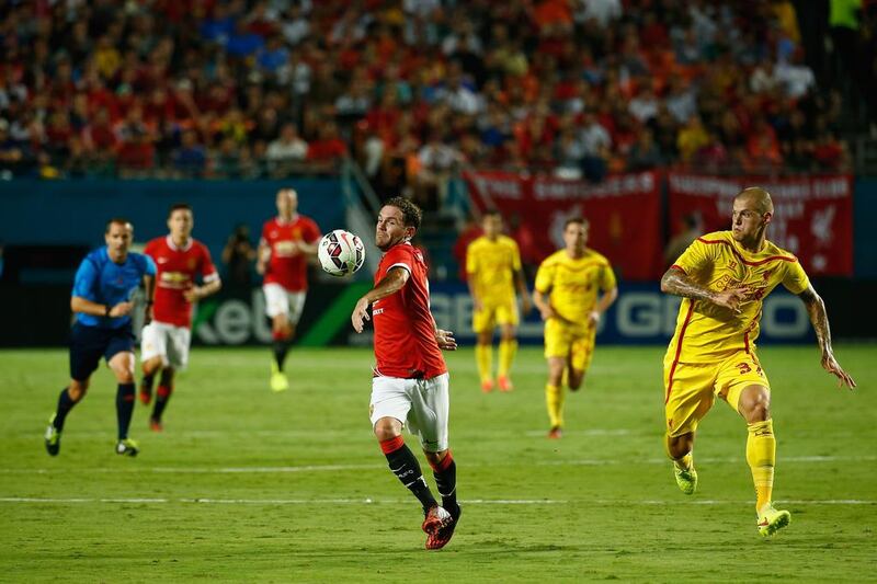 Juan Mata, left, of Manchester United battles with Martin Skrtel of Liverpool in the Guinness International Champions Cup 2014 Final at Sun Life Stadium on August 4, 2014 in Miami Gardens, Florida. Chris Trotman/Getty Images