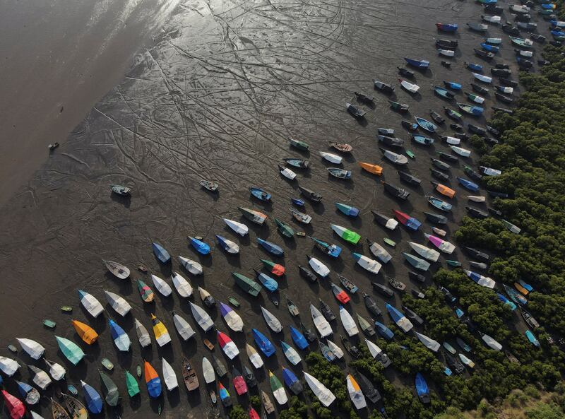 Fishing boats sit on the beach before the start of the monsoon season, on the outskirts of Mumbai, India. Reuters
