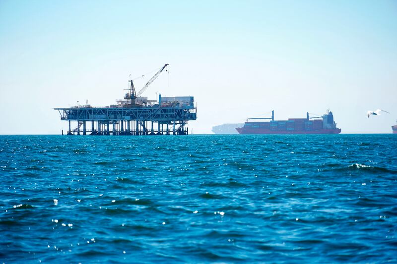 Cargo vessels are anchored offshore before heading into the Los Angeles-Long Beach port. Environmentalists have long complained about poor federal oversight of pipeline companies. AP