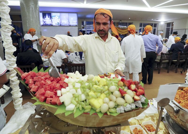 Dubai, United Arab Emirates - May 15, 2019: People take part in a multi faith Iftar at Gurunanak Darbar Sikh Gurudwara. Wednesday the 15th of May 2019. Jebel Ali, Dubai. Chris Whiteoak / The National