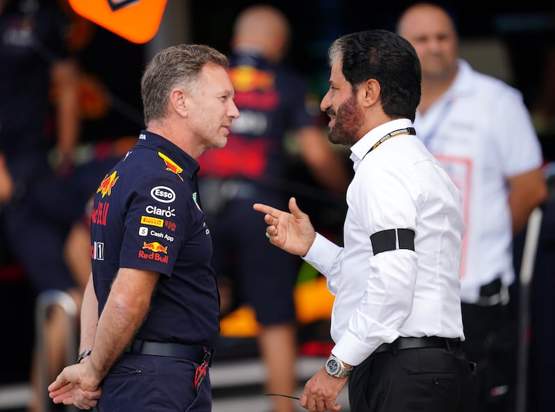 FIA president Mohammed Ben Sulayem, right, speaks with Red Bull Racing team principal Christian Horner prior to first practice at the Italian Grand Prix, Monza on September 9, 2022. EPA
