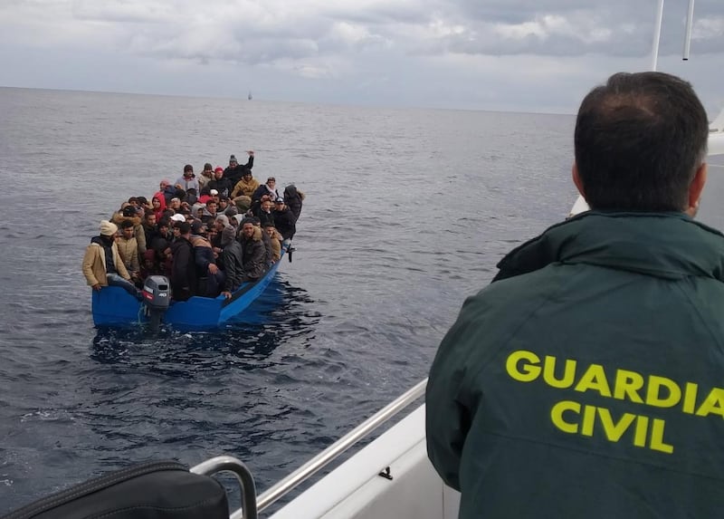 epa07290489 A handout picture provided by the Spanish Civil Guard and Spanish Sea Rescue Services shows a small boat carrying some migrants at sea, near Barbate, Cadiz, southern Spain, 16 January 2019. A total of 124 migrants were rescued at sea while trying to reach Spanish soil traveling on two small boats.  EPA/SPANISH CIVIL GUARD HANDOUT  HANDOUT EDITORIAL USE ONLY/NO SALES