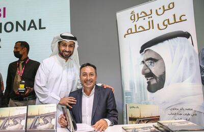Raed Barqawi, seated, during the launch of the English translation of 'Dare to Dream' at the Abu Dhabi International Book Fair. Photo: Raed Barqawi