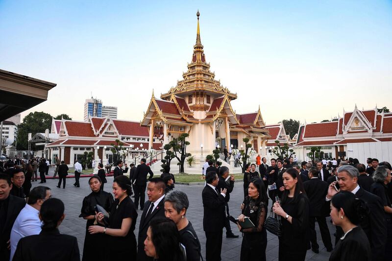 Mourners from Thailand's elite arrive at the Wat Thepsirin Buddhist temple in Bangkok for the funeral ceremony of Leicester City's owner and duty-free mogul Vichai Srivaddhanaprabha. AFP
