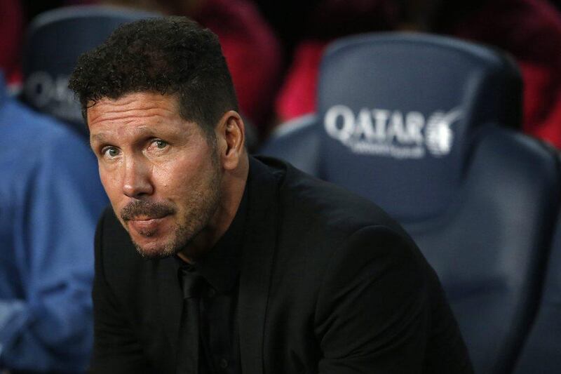 Atletico Madrid manager Diego Simeone looks on before the match against Barcelona. Pau Barrena / AFP